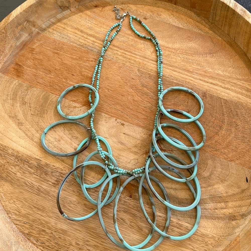 Turquoise plastic hoop necklace with silver clasp